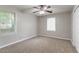 This bedroom has warm neutral-colored walls and two bright windows at 61 Springside Se Dr, Atlanta, GA 30354
