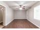 A spacious bedroom with hardwood floors, ceiling fan, and neutral paint at 61 Springside Se Dr, Atlanta, GA 30354