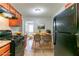 Bright kitchen with dining area featuring modern table set and adjacent living area at 61 Springside Se Dr, Atlanta, GA 30354