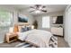This staged bedroom features a ceiling fan and warm decor at 61 Springside Se Dr, Atlanta, GA 30354