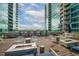 Rooftop deck featuring modern fire pits, ample seating, and stunning city views for residents at 943 Peachtree Ne St # 1518, Atlanta, GA 30309