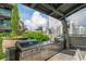 Outdoor grilling station with stainless steel grills and countertop space, perfect for entertaining with a city view at 943 Peachtree Ne St # 1518, Atlanta, GA 30309