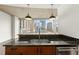 Kitchen with stainless steel appliances, tile backsplash, and granite countertops with city view at 943 Peachtree Ne St # 1518, Atlanta, GA 30309