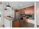 Modern kitchen with stainless steel appliances, granite countertops, and dark wood cabinetry at 943 Peachtree Ne St # 1518, Atlanta, GA 30309