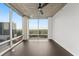 Living room with floor-to-ceiling windows offering amazing views and a modern ceiling fan at 943 Peachtree Ne St # 1518, Atlanta, GA 30309