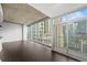 Bright living room with floor-to-ceiling windows and balcony access offering a beautiful city view at 943 Peachtree Ne St # 1518, Atlanta, GA 30309