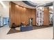 Stunning lobby with wood paneling, modern lighting, chic seating, and sleek tile flooring for a welcoming entrance at 943 Peachtree Ne St # 1518, Atlanta, GA 30309