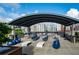Outdoor kitchen and gathering space with multiple seating areas, cooking stations, and city views at 943 Peachtree Ne St # 1518, Atlanta, GA 30309