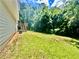 Spacious backyard featuring a small deck and lush greenery at 186 Grapevine Dr, Douglasville, GA 30134