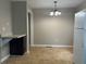 Eat-in kitchen with a dining area, featuring modern lighting and refrigerator at 186 Grapevine Dr, Douglasville, GA 30134