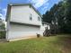 Back of home view showcasing a white sided home with a deck at 186 Grapevine Dr, Douglasville, GA 30134