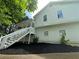 Two-story home with white siding, a front porch and mulch landscaping at 186 Grapevine Dr, Douglasville, GA 30134