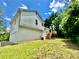 Exterior view shows a white home with a deck, patio, and attached garage at 186 Grapevine Dr, Douglasville, GA 30134