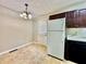 The kitchen features tile floors, black appliances, and a window bringing in natural light at 186 Grapevine Dr, Douglasville, GA 30134