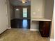 The living room is connected to the kitchen area, with dark wood floors at 186 Grapevine Dr, Douglasville, GA 30134