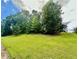 Well-maintained lawn with mature trees, offering a serene outdoor space at 186 Grapevine Dr, Douglasville, GA 30134
