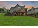 Large backyard features a multilevel deck and a lush green lawn, ideal for entertainment and relaxation at 3760 Ansley Park Dr, Suwanee, GA 30024
