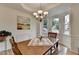 Inviting dining area featuring hardwood floors, bay windows, and soft natural light at 3760 Ansley Park Dr, Suwanee, GA 30024