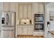 Stylish kitchen featuring stainless steel appliances, custom cabinetry, and granite countertops at 3760 Ansley Park Dr, Suwanee, GA 30024