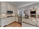 Well-appointed kitchen featuring stainless steel appliances, granite countertops, and an open layout at 3760 Ansley Park Dr, Suwanee, GA 30024