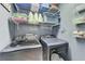 Well-organized laundry room with storage shelves and modern washer and dryer at 3760 Ansley Park Dr, Suwanee, GA 30024