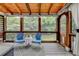The covered patio features lots of light and beautiful views at 3760 Ansley Park Dr, Suwanee, GA 30024