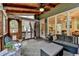 Covered porch with wood ceiling with access to kitchen and living room at 3760 Ansley Park Dr, Suwanee, GA 30024