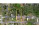 Aerial view of property lot and surrounding neighborhood with mature trees at 493 James Street Sw, Lilburn, GA 30047