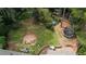 Backyard featuring a trampoline, fire pit, and outdoor dining set at 493 James Street Sw, Lilburn, GA 30047