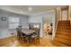 Charming dining room boasts hardwood floors, decorative molding, and an open floorplan, perfect for entertaining guests at 493 James Street Sw, Lilburn, GA 30047