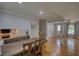 Cozy dining area with seating, seamlessly connects to an adjacent Gathering room with a fireplace at 493 James Street Sw, Lilburn, GA 30047