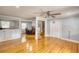 Open-concept living space featuring hardwood floors, and open access to the kitchen at 493 James Street Sw, Lilburn, GA 30047