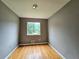 Bedroom with hardwood floor, window, and gray walls at 6616 King George Way, Morrow, GA 30260