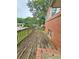 View of exterior wooden deck with brick home at 6616 King George Way, Morrow, GA 30260