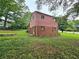 A backyard view of a two story house at 6616 King George Way, Morrow, GA 30260