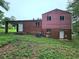 Backside exterior view of a two story home with brick and siding at 6616 King George Way, Morrow, GA 30260
