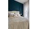 Comfortable bedroom with large upholstered headboard and natural light from a window at 6620 Wellington Sq, Norcross, GA 30093