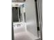 Walk-in closet with illuminated mirror, storage, and shelving at 6620 Wellington Sq, Norcross, GA 30093