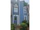 Charming two-story home with blue siding and a well-maintained front yard at 6620 Wellington Sq, Norcross, GA 30093