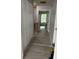 Upstairs hallway with wood floors and white storage closet at 6620 Wellington Sq, Norcross, GA 30093