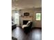Cozy living room with dark wood floors, fireplace, and lots of natural light at 6620 Wellington Sq, Norcross, GA 30093