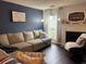 Comfortable living room with a fireplace, a cozy couch, and decorative accents at 6620 Wellington Sq, Norcross, GA 30093