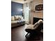 Cozy living room with stylish chair, couch, fireplace, and lots of natural light at 6620 Wellington Sq, Norcross, GA 30093