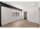 Cozy bedroom featuring hardwood floors, a large window, and a closet nearby at 108 Park Place Unit 107, Decatur, GA 30030