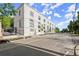 Stylish white building featuring arched windows and modern design, complemented by landscaped surroundings at 108 Park Place Unit 107, Decatur, GA 30030
