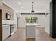 Modern kitchen with an island, stainless steel appliances, and sleek cabinetry at 108 Park Place Unit 107, Decatur, GA 30030