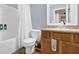 Functional bathroom with vanity, shower, and neutral color scheme at 1267 Castleberry Dr, Buford, GA 30518