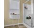Modern bathroom includes a glass-enclosed shower, a stand, and a window for natural light at 1267 Castleberry Dr, Buford, GA 30518