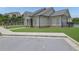 Well-maintained clubhouse with stone accents, green lawn, and sidewalk access at 1267 Castleberry Dr, Buford, GA 30518
