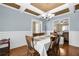 Beautiful dining room with an elegant chandelier, and hardwood floors, perfect for Gathering gatherings at 1267 Castleberry Dr, Buford, GA 30518